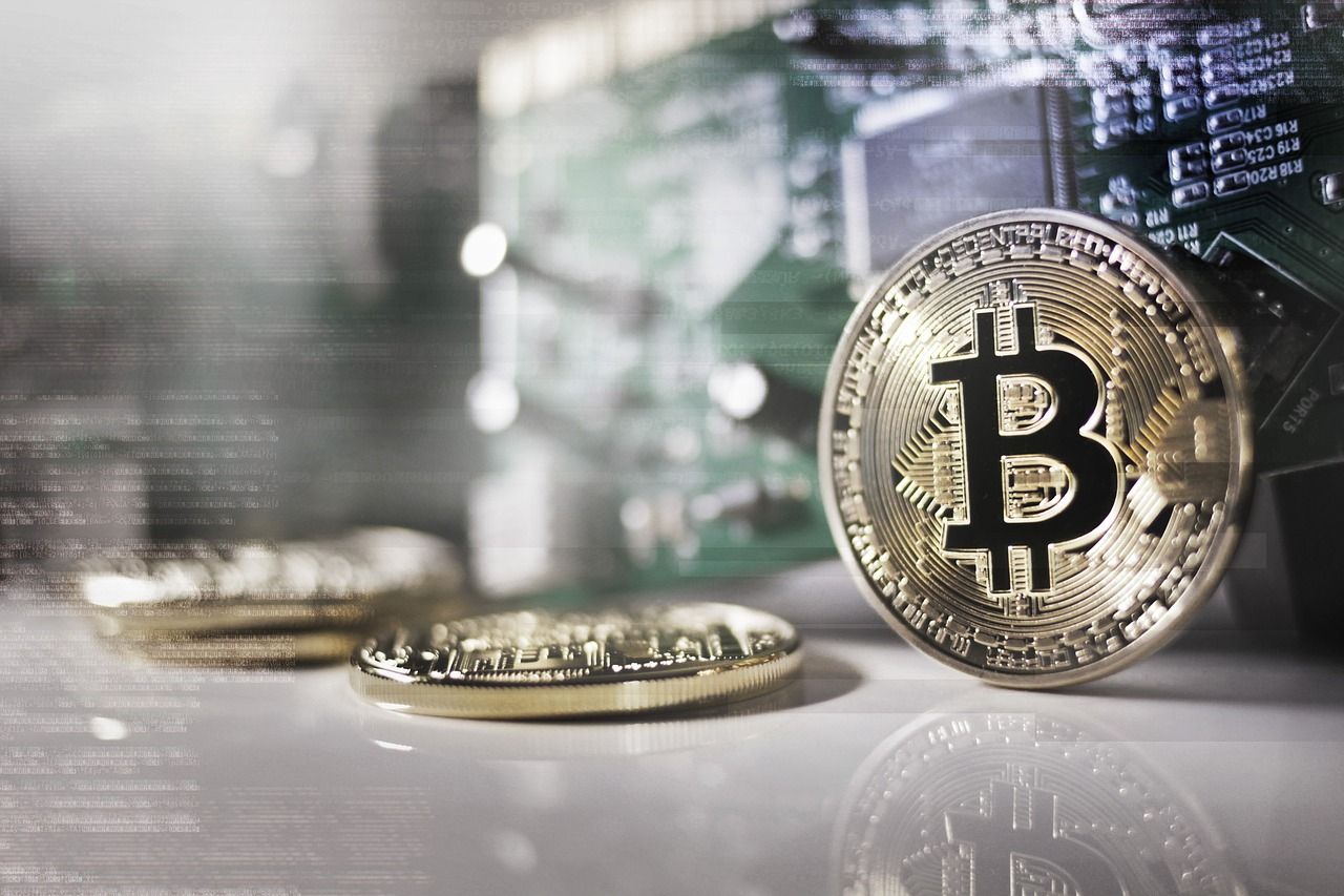 BlackRock and Jio Financial Services logos with digital asset icons representing crypto investments in India.